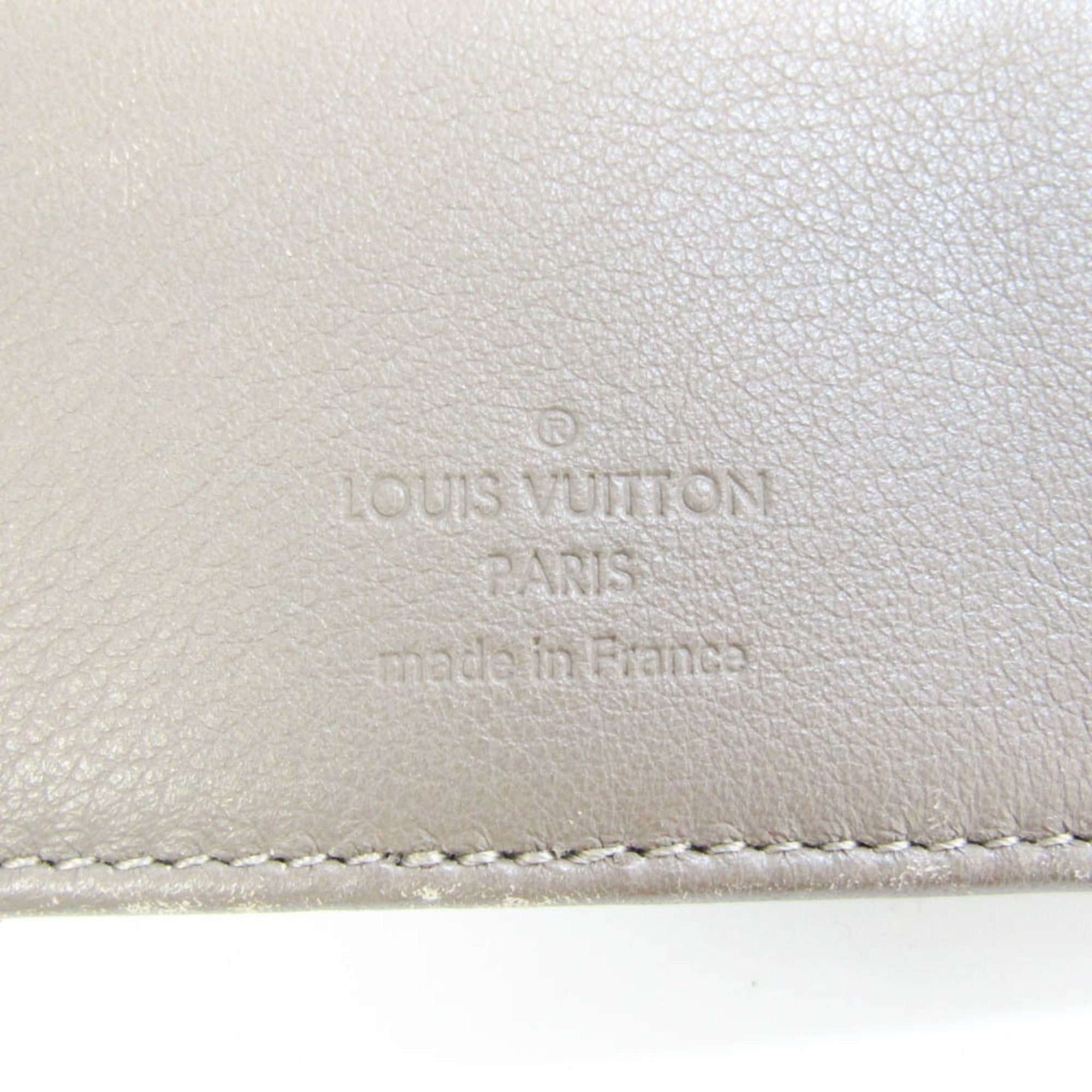 Louis Vuitton Beige Leather Mahina wallet accessories