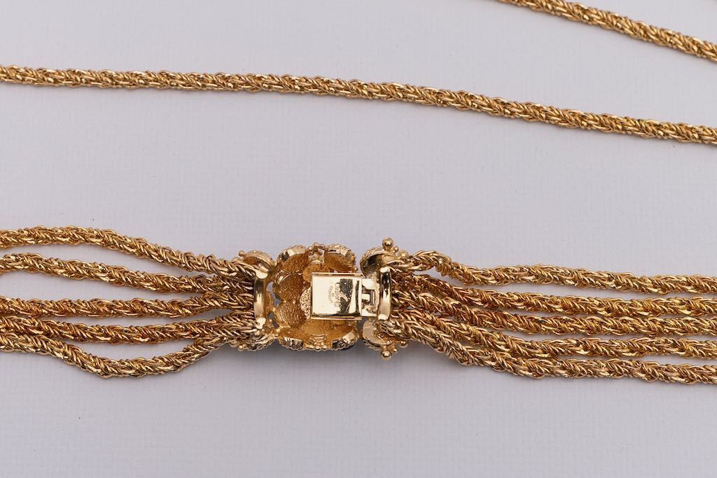Collier en métal doré et fermoir bijou Dior